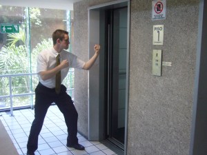 a guy standing outside an elevator