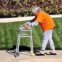 an old woman using a walker